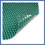 A close-up image of a rectangular, green bubble wrap sheet with small, round air pockets. The top-right corner of the sheet is slightly lifted to show the backside. The edges are bordered with a blue outline. | AES - Pool Heating & Energy Efficient Products