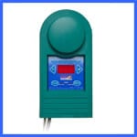 A green electronic device with a circular component on top and a rectangular blue display screen below. The screen has a red digital readout and three white buttons with arrow icons around it. The entire device is against a white background with a blue frame. | AES - Pool Heating & Energy Efficient Products